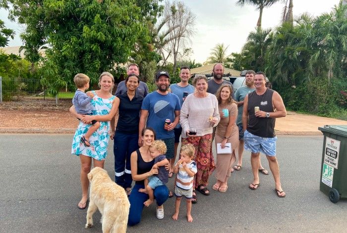 Neighbors standing together in their street