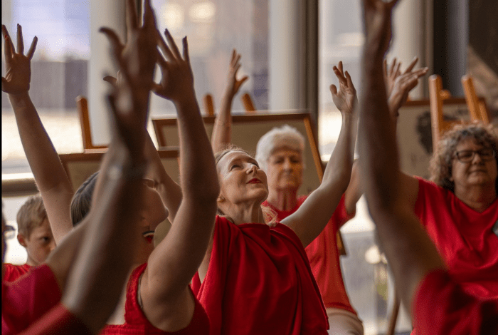 Women reaching up to the sky